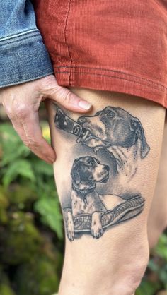 a person with a dog tattoo on their leg