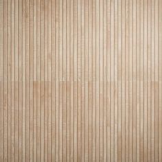 a wooden paneled wall with vertical stripes in light brown and beige tones, as well as horizontal lines on the wood