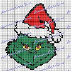 a cross stitch christmas ornament with santa's hat on top