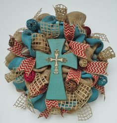 a wreath with a cross on it and burlocks