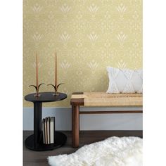 a living room scene with focus on the floor and wall papered in gold color