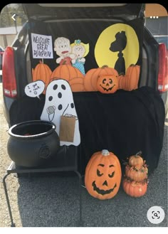 the back of a truck with pumpkins and jack - o'- lantern decorations