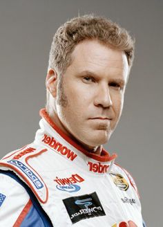 a close up of a person wearing a racing suit and looking at the camera with a serious look on his face