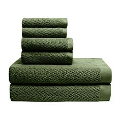 four green towels stacked on top of each other