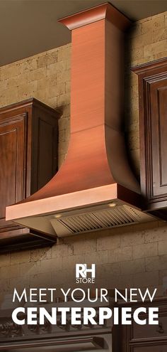 a copper range hood with the words meet your new centerpiece