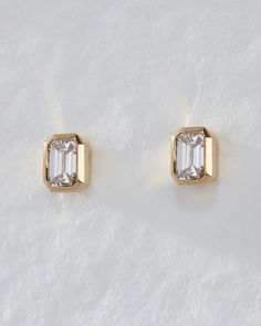 Add a touch of everyday chicness with our Bezel-Set Diamond Stud Earrings, featuring stunning emerald-cut diamonds available in two sizes, set in a sleek and minimalist bezel setting. Ideal for any lobe piercing, these earrings offer a comfortable fit and low maintenance wear thanks to the flat bezel setting. 1ct Diamond Earrings, Emerald Cut Diamond Earrings, Bezel Set Diamond Earrings, Simple Diamond Earrings, Emerald Cut Earrings, Yellow Gold Diamond Earrings, Bezel Set Earrings, Dazzling Earrings, Bezel Earrings