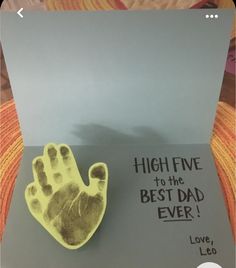 a brooch that says high five to the best dad ever with a handprint on it