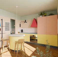 an image of a kitchen setting with yellow and pink colors on the walls, wood flooring and stools