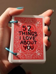 a woman holding up a card with the words 5 things i love about you written on it