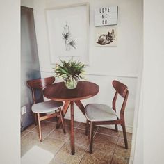 two chairs and a table in a room