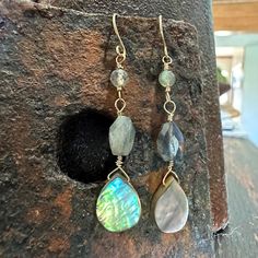 Labradorite and Abalone Earrings, Faceted Labradorite Teardrop Earrings with gold filled wires Details: Handmade item Approximately 2" drop (including ear wire) Materials: Gold Filled  Stone: Labradorite and Abalone Shell Caring for Gold Filled items is as easy as caring for any gold jewelry. Simply keep away from chemicals, clean regularly with mildly sudsy water, rinse well and pat dry with a non-scratching cloth. Polish gently with a jewelry polishing cloth. To do this, use a microfiber cloth Abalone Earrings, Bijoux Fil Aluminium, Special Jewelry, Wrapped Jewelry, Abalone Shell, Microfiber Cloth, Ear Wire, Wire Wrapped Jewelry, Teardrop Earrings