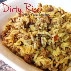 a white bowl filled with rice and meat on top of a marble countertop in front of a red sign that says dirty rice don't recipe creations