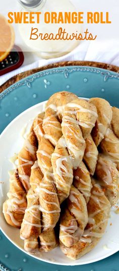 sweet orange roll breadsticks on a blue plate