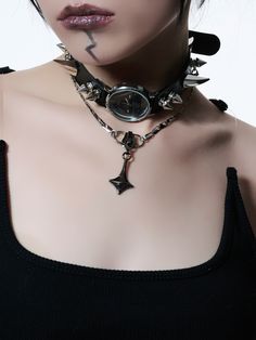 This versatile choker is crafted from solid-colored PU leather, exuding a sleek and sophisticated vibe. Adorned with striking silver-tone irregular studs, it adds a touch of rebellious charm. The centerpiece features a metal clock and pendant, combining a unique blend of elegance and intrigue. With its adjustable design, this choker caters to all neck sizes, ensuring a perfect fit for everyone. The detachable layered chains offer multiple styling options, allowing you to customize your look effo Gothic Silver Jewelry With Rivets, Edgy Black Spiked Choker, Punk Spikes Choker For Party, Punk Spiked Choker For Parties, Edgy Spiked Choker For Party, Edgy Rivets Jewelry, Edgy Silver Jewelry With Rivets, Alternative Style Silver Jewelry With Rivets, Black Cyberpunk