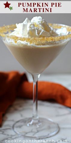 pumpkin pie martini in a glass with whipped cream on top