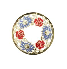 a red, white and blue flowered broochle on a white background's surface