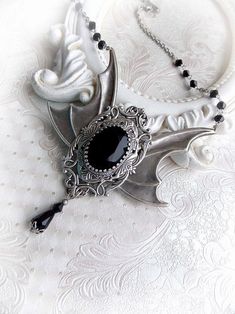 "Gothic inspired necklace 'Wings of midnight' by Midnight Vision Jewelry Gothic necklace featuring a genuine black Swarovski crystal on ornated aged silver base with large bat wings. Below is hanging a black matching crystal drop and smaller bicone bead with a little silver bead. The chain is decorated with same kind beads. Please choose the length of the chain for a perfect fit. Please note, the length options are refer only for the chain length. * The metal parts are of high quality brass * Ni Statement Silver Necklace, Vampire Necklace, Antique Silver Necklace, Gothic Vampire, Jewelry Gothic, Necklace Gothic, Dark Style, Black Jewel, Gothic Necklace