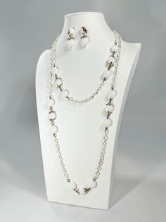 This vintage Crown Trifari necklace and earring set is made of milk glass with gold colored accents. My grandmother bought and wore this in the 1950s so it has a little bit of wear but that was the last time anyone utilized it. It's 54" long in total and needs a new home. White Glass Jewelry For Party, Vintage White Necklace For Party, Vintage White Necklaces For Formal Occasions, Handmade White Jewelry For Evening, White Vintage Necklace For Formal Occasions, White Vintage Party Necklace, White Costume Jewelry For Formal Occasions, Vintage Glass Jewelry With Matching Earrings, Handmade White Glass Jewelry