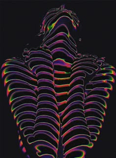 an abstract photograph of the back of a person's head and neck in neon colors