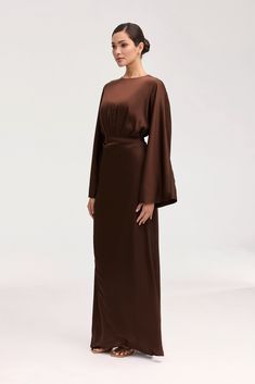 Introducing our Cedra Satin Wrap Maxi Dress in Chocolate, perfect for any formal occasion. This luxurious, full-length dress features a wrap front design, stunning flare sleeves, and a versatile tie waist for a flattering silhouette. Elevate your style with this elegant and sophisticated piece. Model is 5'7 and is wearing size XS/58". White Dress Formal, Dresses Flowy, Nikkah Dress, Wrap Maxi Dress, Flare Sleeves, Engagement Dresses, Full Length Dress, Basic Dress, Ribbed Dresses