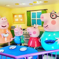 peppa pig inflatables are on display at the children's museum