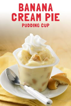 banana cream pie pudding cup on a plate with a spoon and napkin next to it