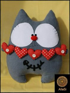 a gray cat with red hearts on it's eyes