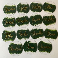 green and gold name badges with names on them for brides, grooms, and guests