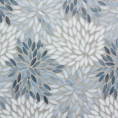 a blue and white wallpaper with leaves on it