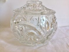 a clear glass jar sitting on top of a table