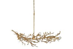 a gold chandelier with branches hanging from it's sides and three lights on each side