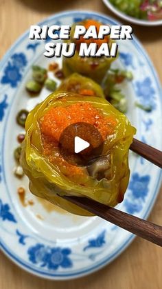 a plate with some food on it and chopsticks sticking out of the top