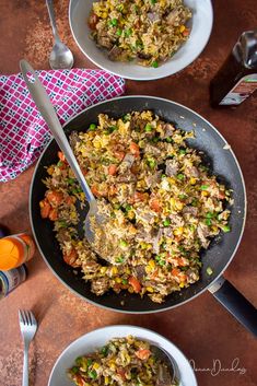 two bowls filled with food on top of a wooden table