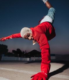 a person doing a hand stand on one leg