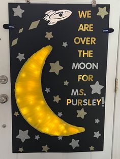 a door with a sign that says we are over the moon for ms pursley