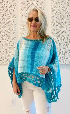 Welcome to LM Handmade Boutique!  New! One of a kind Turquoise Island Poncho  Wrap yourself in the color of the tropics with this  beautiful poncho made with buttery soft turquoise yarn and freestyle crochet detail.  This one of a kind top will make your wardrobe shine! Perfect for layering in any season, more than just fashion--wearable art. Whether you're heading out for a casual day or dressing up for an evening event, this poncho adds a statement piece to your wardrobe. Limited Edition** Onc Bohemian Crochet Shawl Poncho, Bohemian Blue Crochet Poncho, Blue Crochet Bohemian Poncho, Blue Bohemian Crochet Poncho, Handmade Bohemian Blue Poncho, Handmade Blue Bohemian Poncho, Bohemian Blue Poncho For Festival, Bohemian Blue Poncho For The Beach, Bohemian Blue Beach Poncho