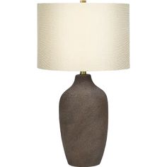 a brown table lamp with a white shade on the base and a beige fabric lampshade