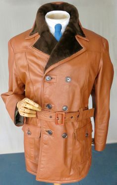 How much do I love this?! Well, for those of you who have been watching WtCM for several years, you may remember I sold my own EXACTLY the same Borg coat (size 36-8") . It's just a brill shorty car coat in striking orange tinged tan leather with a brown synthetic fur collar and lining. The finish and stying is excellent and that lining is plush and warm. This one has had wear but it's al there and the lining is very clean. 42" + chest : 24" p-p/ 21" shoulder/ 25.5" sleeve/ 34" length 120£ Vintage Outerwear With Faux Fur Lining And Long Sleeves, Retro Belted Outerwear For Fall, Fitted Retro Fur Coat For Fall, Retro Lined Outerwear For Fall, Retro Belted Fall Outerwear, Vintage Brown Long Pea Coat, Vintage Long Brown Pea Coat, Retro Brown Double-breasted Outerwear, Retro Double-breasted Outerwear With Button Closure