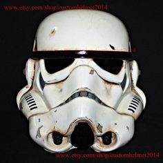 a star wars helmet that looks like it has been painted white and is worn black