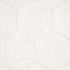 a white hexagonal tile wallpaper with no pattern on the bottom and sides