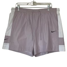 The Nike Sportswear Shorts Update A Classic Gym Short Silhouette With Lightweight Recycled Woven Fabric. Color-Blocking On The Side Seams Provides A Casual, Understated Look. This Product Is Made With 100% Recycled Polyester Fibers. Recycled Woven Fabric This Lightweight Fabric Recycled Fabric Has A Soft, Smooth Feel. Comfortable Feel An Encased Elastic Waistband And Adjustable Drawcord Provide A Comfortable, Personalized Fit. Updated Gym Style Color-Blocking Details And Printed Swoosh Provide A Purple Casual Activewear For Light Sports, White Nylon Athletic Shorts For Gym, White Nylon Athletic Shorts For Sports, White Nike Athletic Shorts For Running, Nike White Athletic Shorts For Running, Nike White Athletic Running Shorts, White Sportswear Shorts For Light Sports, White Nike Running Bottoms, White Athletic Shorts For Light Sports