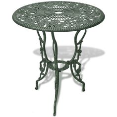 an iron table with intricate designs on the top and bottom, against a white background