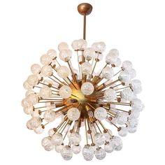 a large chandelier with many glass balls hanging from it's center point