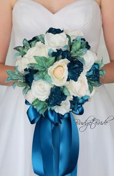 a bridal bouquet with white and blue flowers