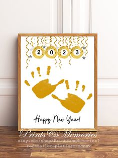 a happy new year card with handprints on it