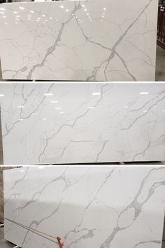 white marble countertops are being displayed in the store