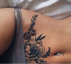 a woman's stomach with flowers on it