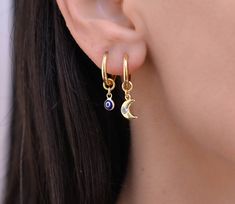 These small hoop earrings are a set of 2 mismatched huggie hoop earrings. The one earring has a evil eye charm on it while the other has a gold charm. Any combination of hoop is available. Hoops - Gold plated surgical stainless steel Charm - gold plated brass Evil Eye - gold plated sterling silver 925 and glass Moon Charm Huggie Earrings, Crescent Single Huggie Earring As Gift, Crescent Shaped Single Huggie Earring Gift, Crescent-shaped Single Huggie Earring As Gift, Moon Charm Huggie Earrings For Gift, Huggie Earrings With Moon Charm Gift, Huggie Hoop Earrings With Moon Charm For Gift, Gift Huggie Earrings With Moon Charm, Hoop Charms