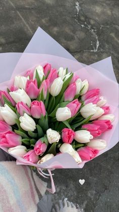 a bouquet of pink and white tulips