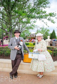 a man and woman dressed up in old fashioned clothing